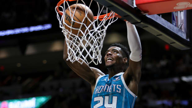 Charlotte Hornets forward Brandon Miller (24) dunks the basketball against the Miami Heat during the second quarter at Kaseya Center on Dec 13, 2023.